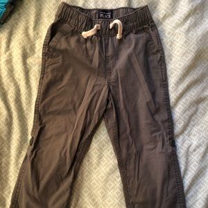 Gray boys pull on pants
